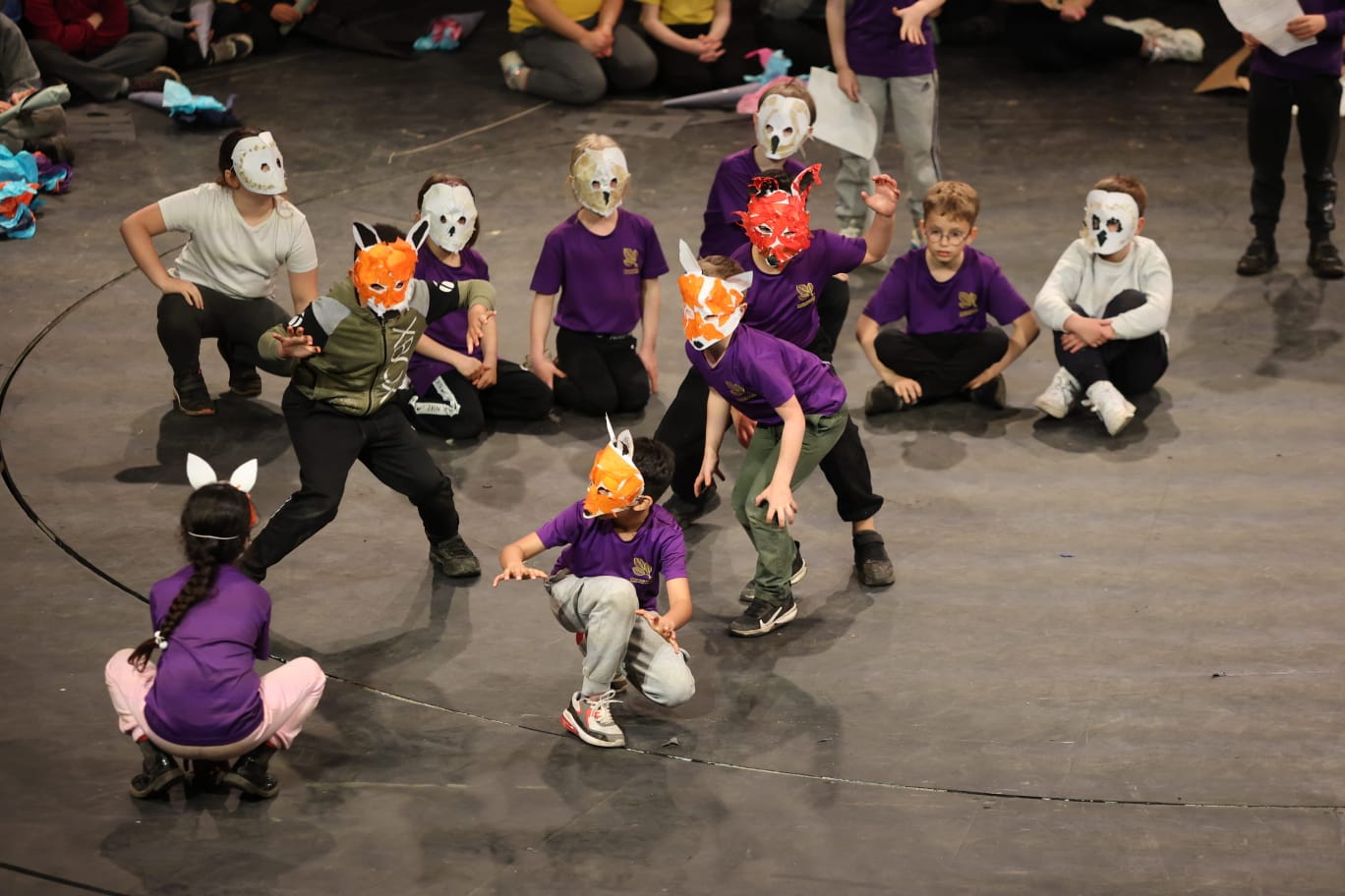 Children performing play in animal masks