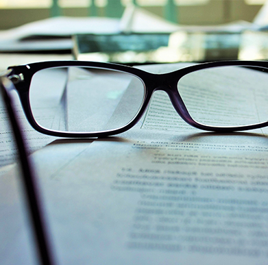 Pair of glasses on a piece of paper