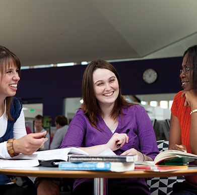 Students sitting at table talking