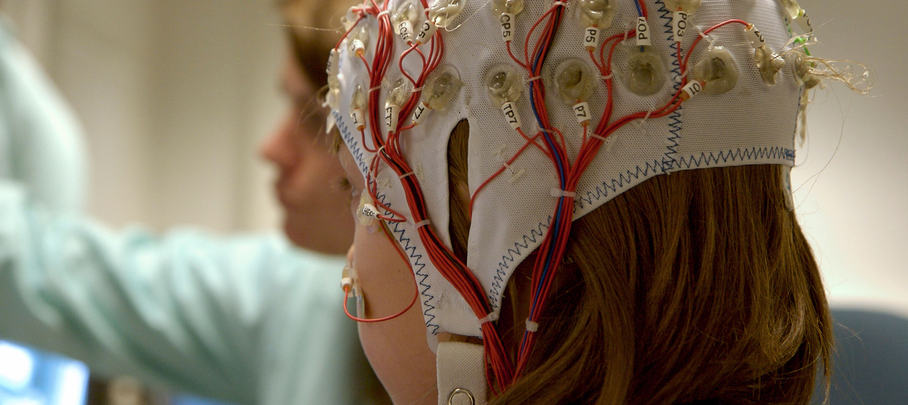 Someone wearing a hat measuring brain activity