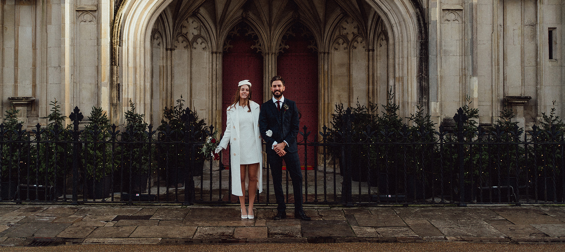 Wedding couple in front of cathedral