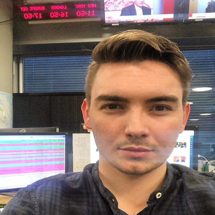 Man standing in front of camera with lighting on face