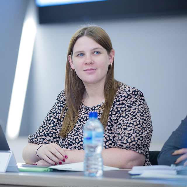 Two women sitting at a conference desk