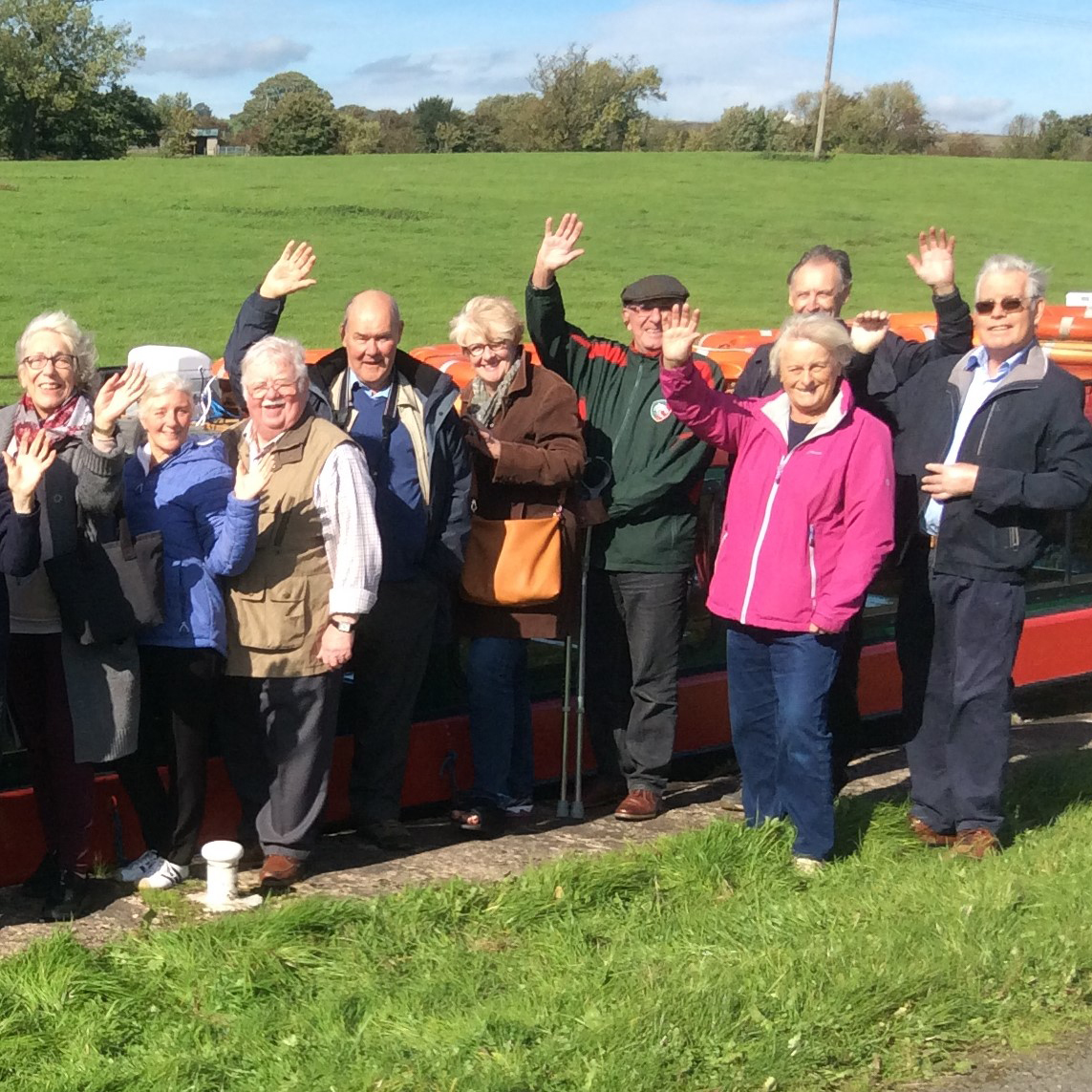 Group of people waving