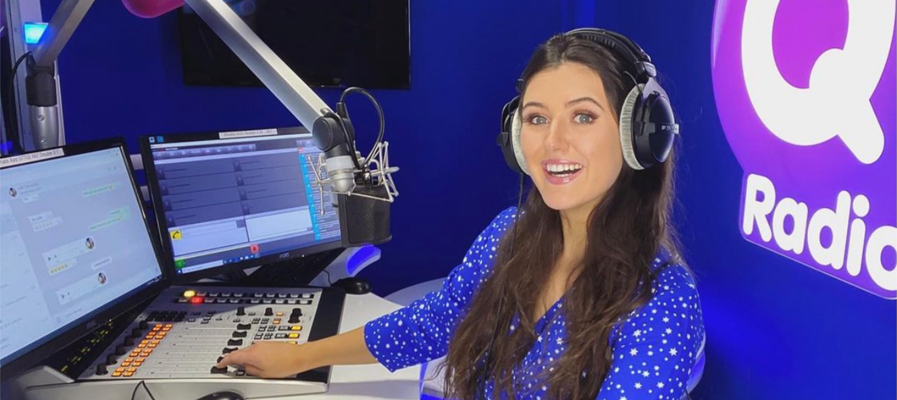 A woman sitting at a radio desk