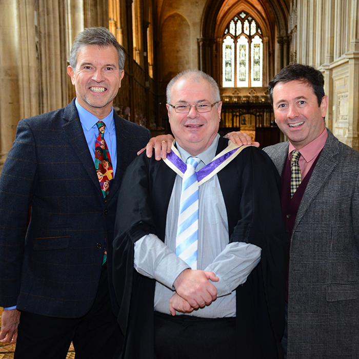 3 men in cathedral