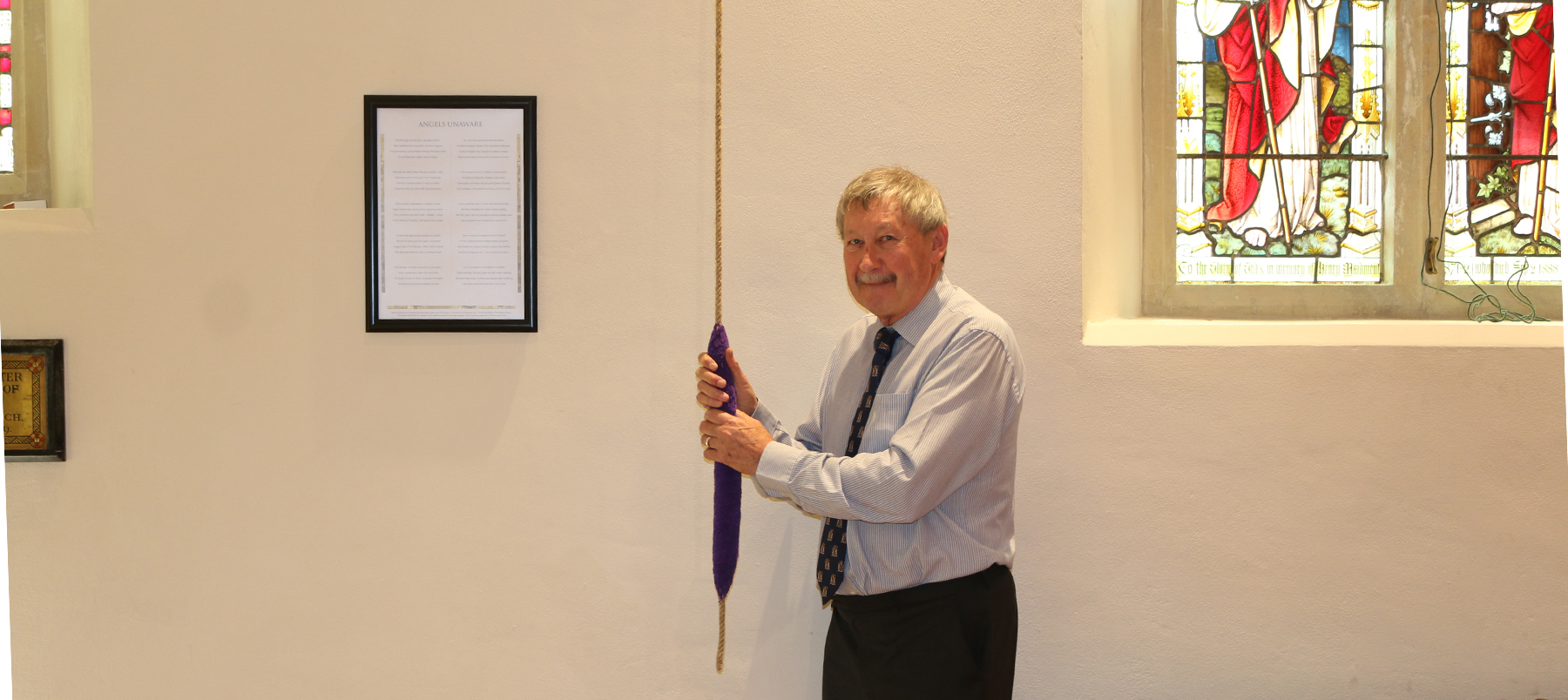 A man pulling a bell rope