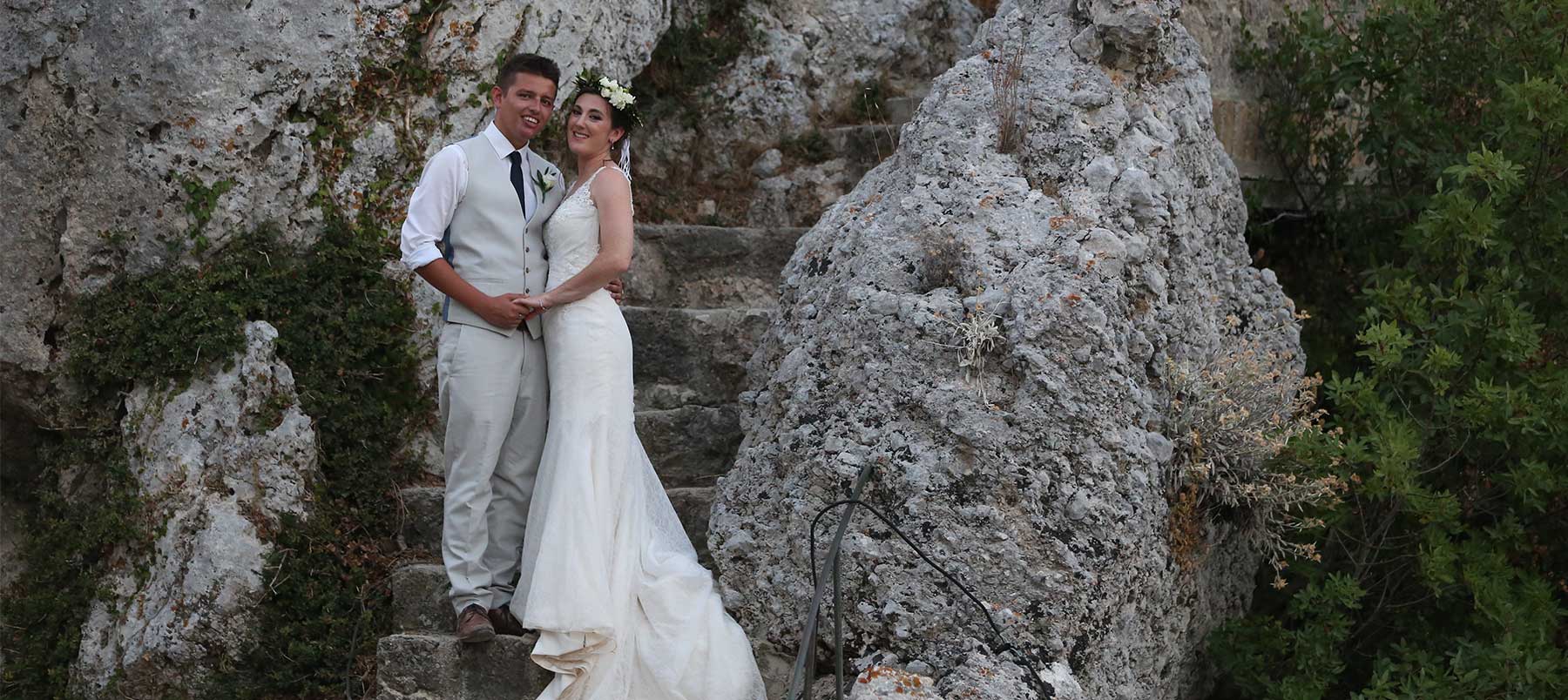 Bride and groom on Greek island steps
