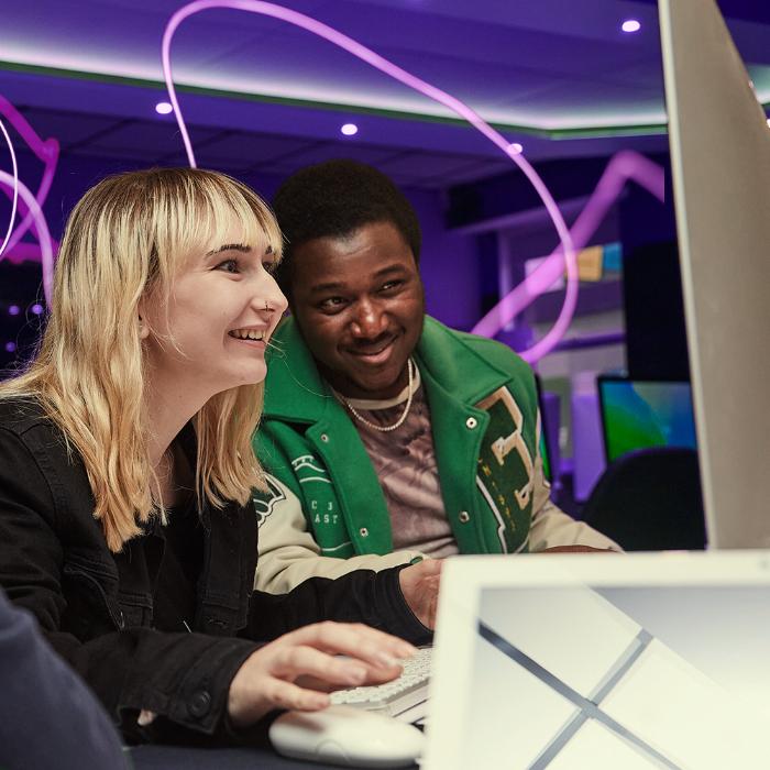 Students looking at a computer