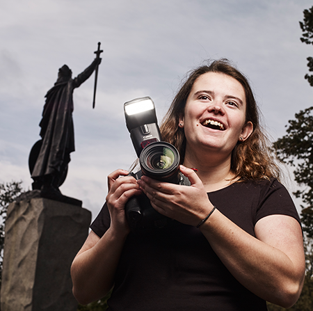 Student holding a camera