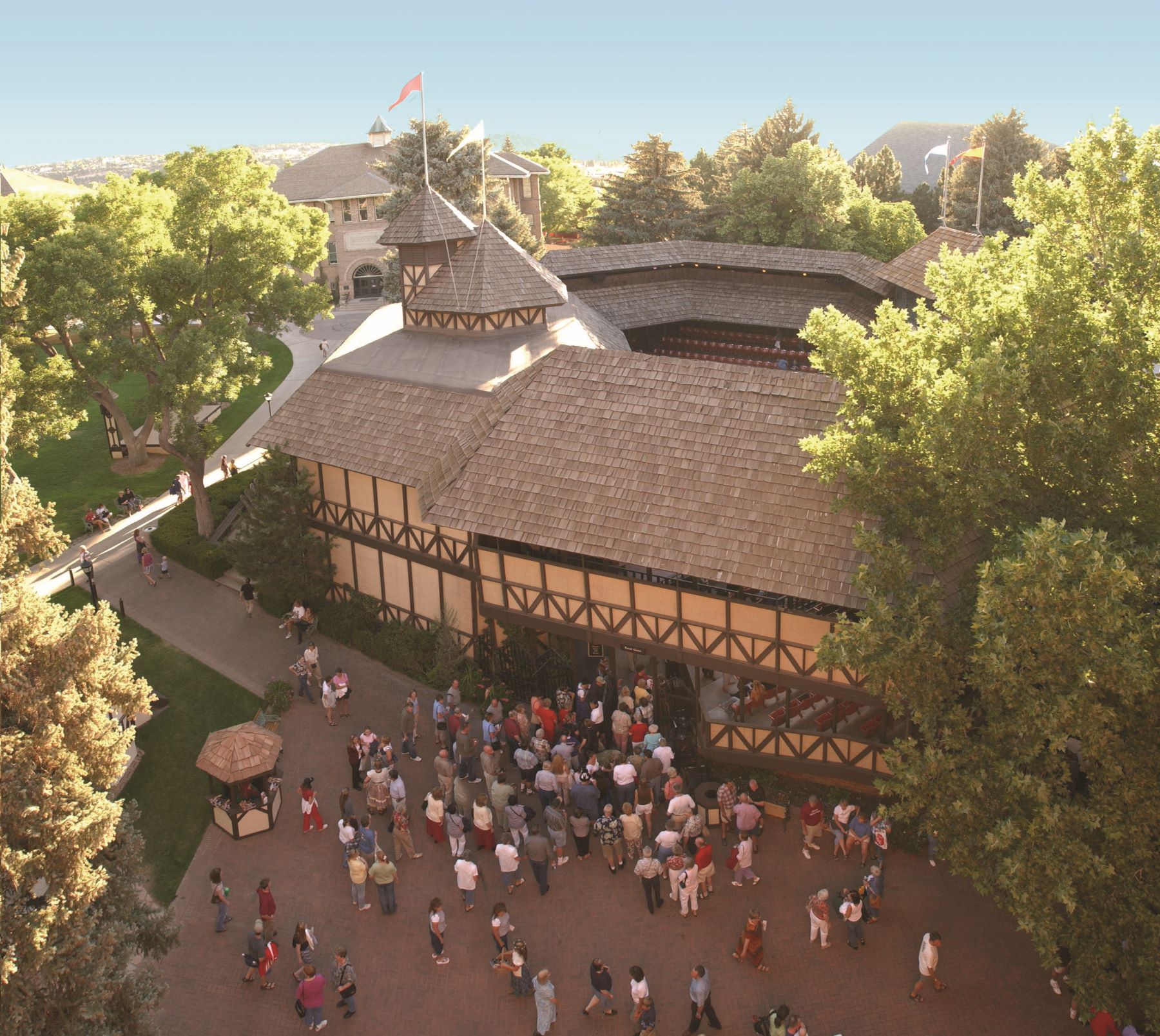 Looking down on Tudor style theatre with crowds outside