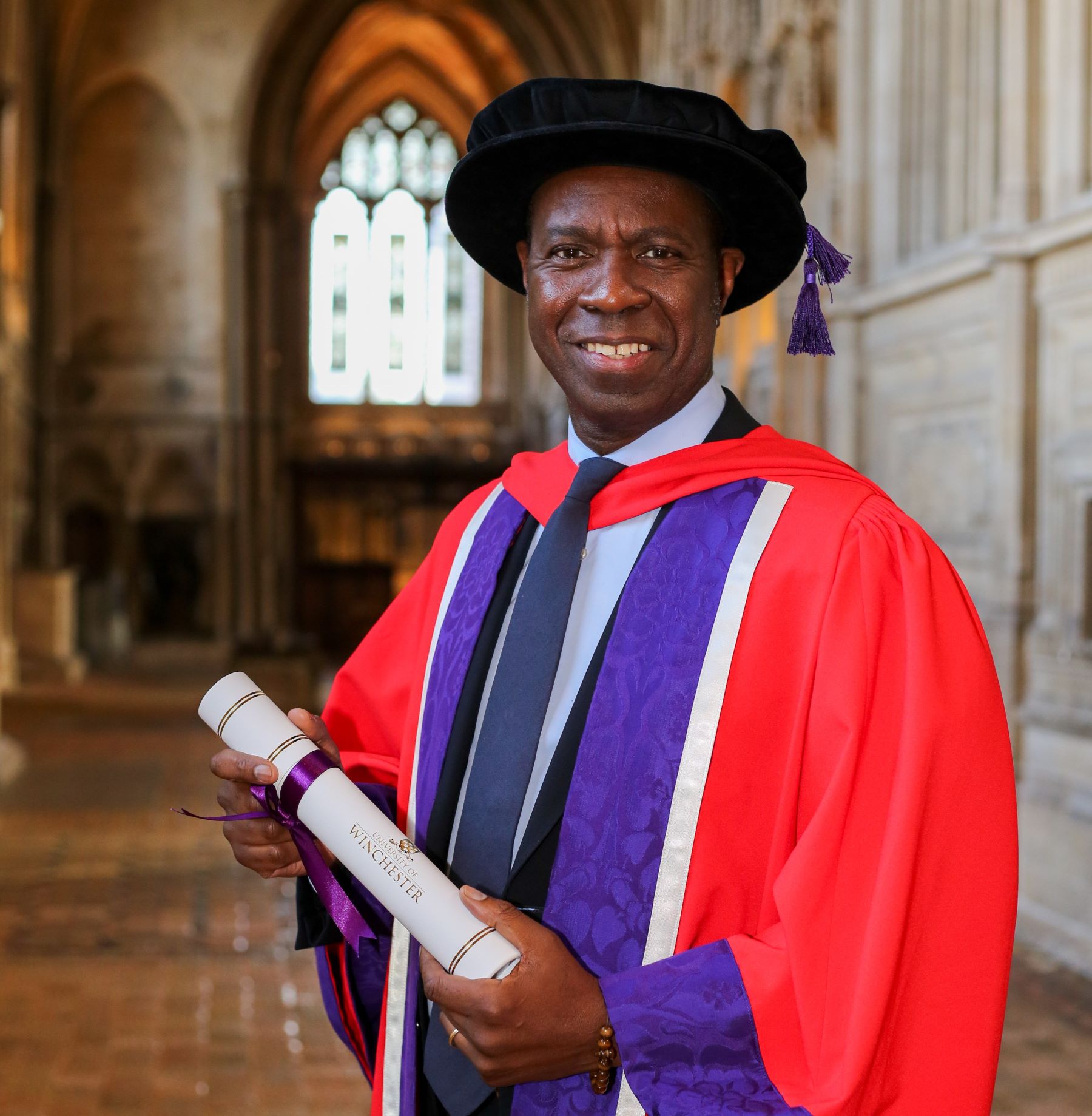 Clive Myrie in graduation robes