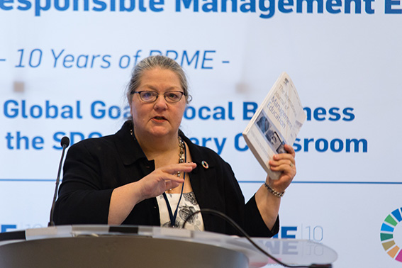 Carole Parkes speaking from a lectern