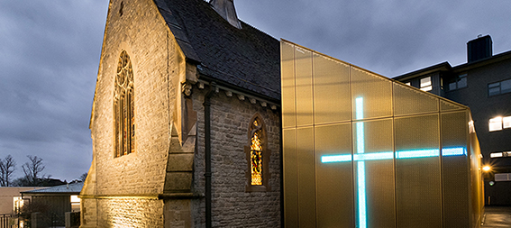 University chapel lit up at night 