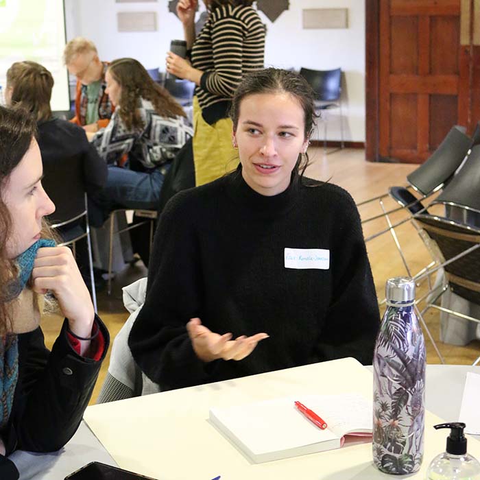 Participants in the climate assembly talking in groups