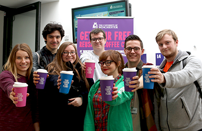 Group of University students pose with their reusable cups