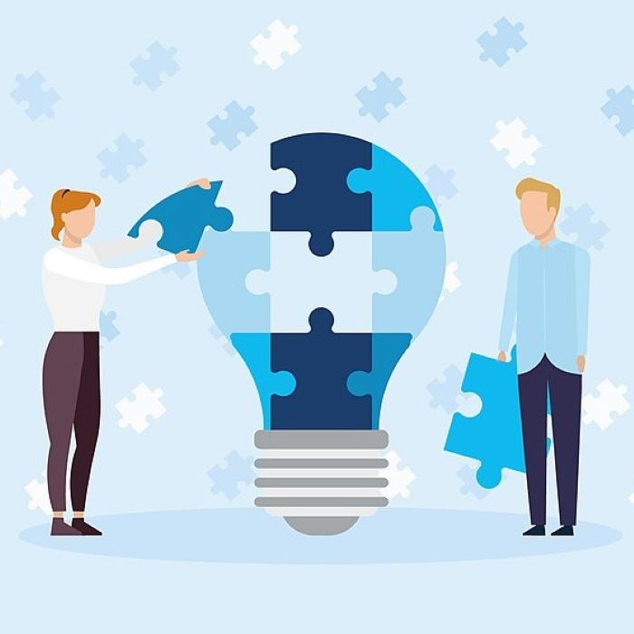 Grpahic showing two figures making a lightbulb with jigsaw pieces