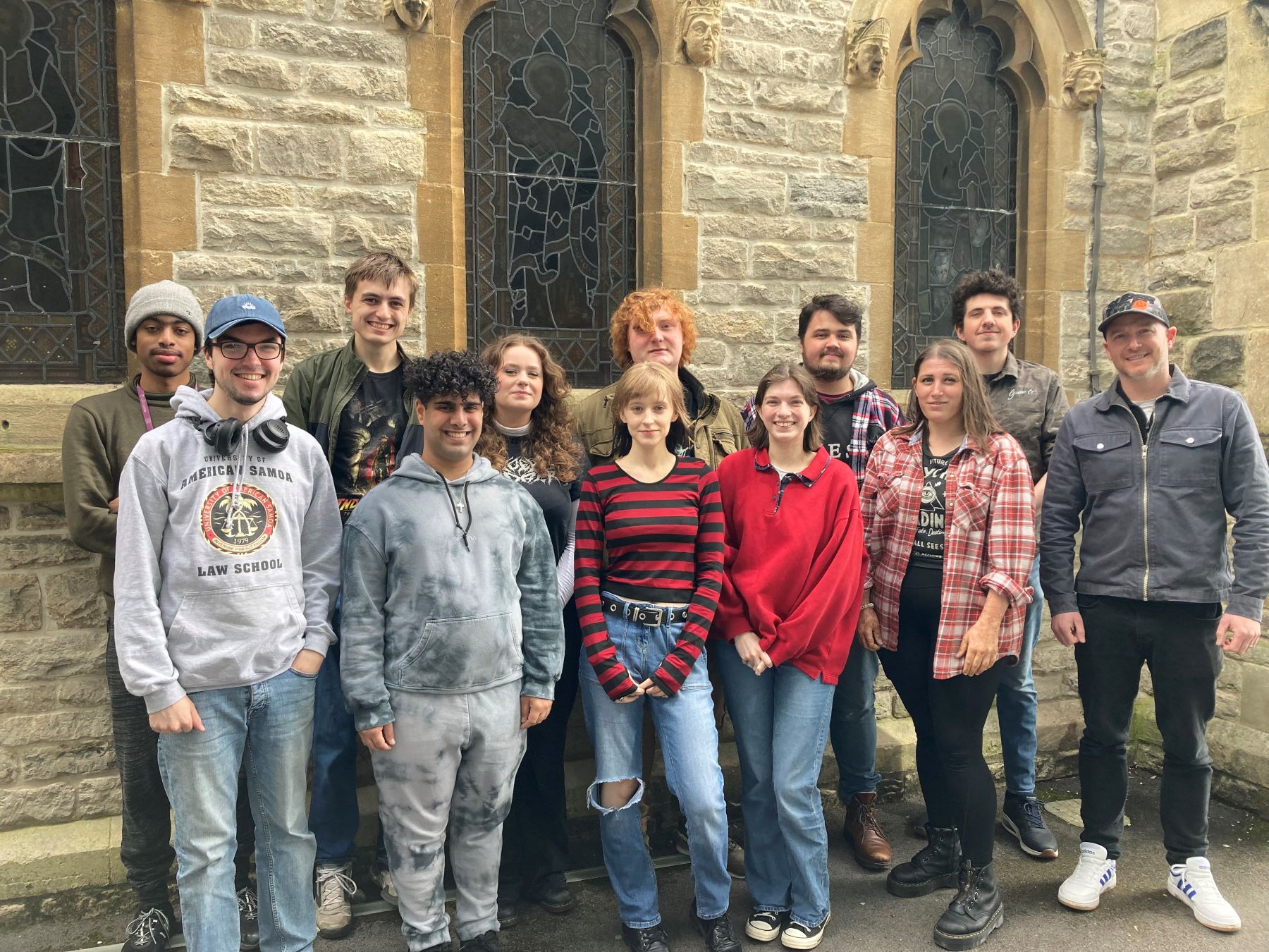 Line up of students by chapel wall