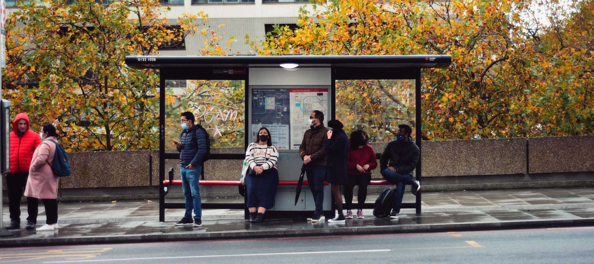 People waiting at a bus stop