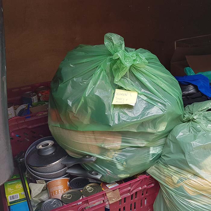 University porters with boxes of donated kitchen ware