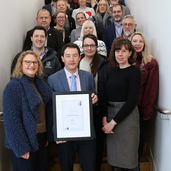 Estates and Facilities staff with their framed award certificate