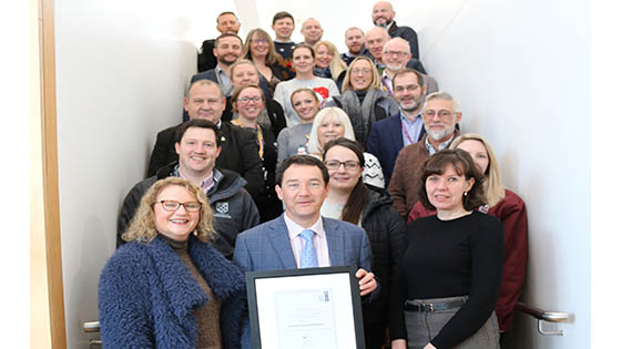 Estates and Facilities staff with their framed award certificate