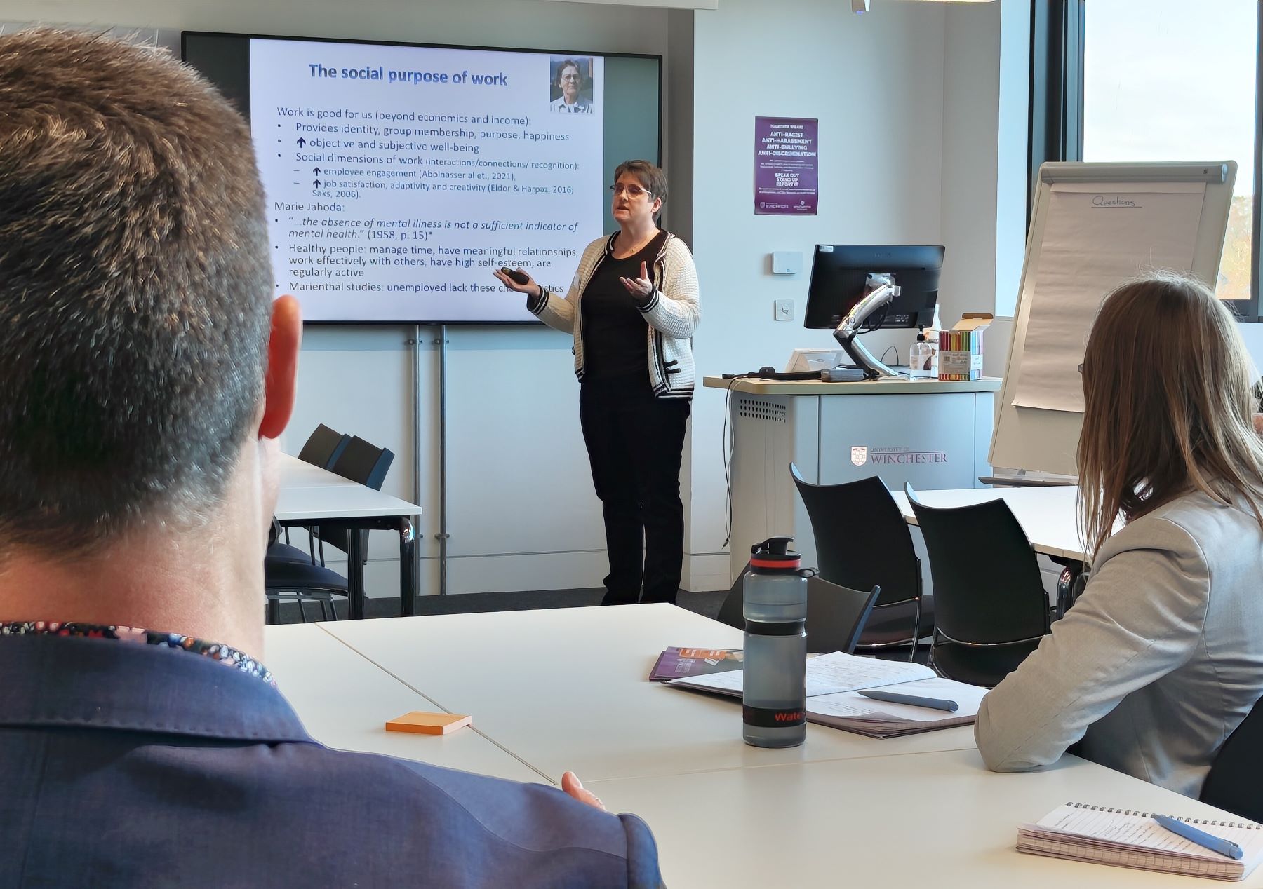 Woman in front of power point screen