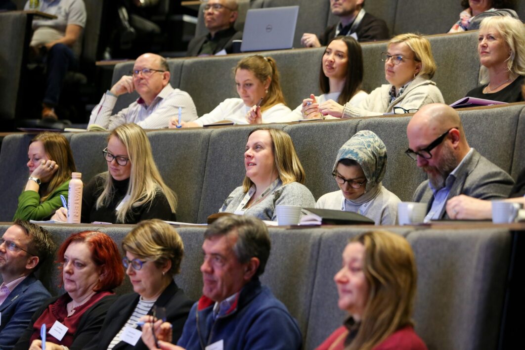 Audience in raked seats