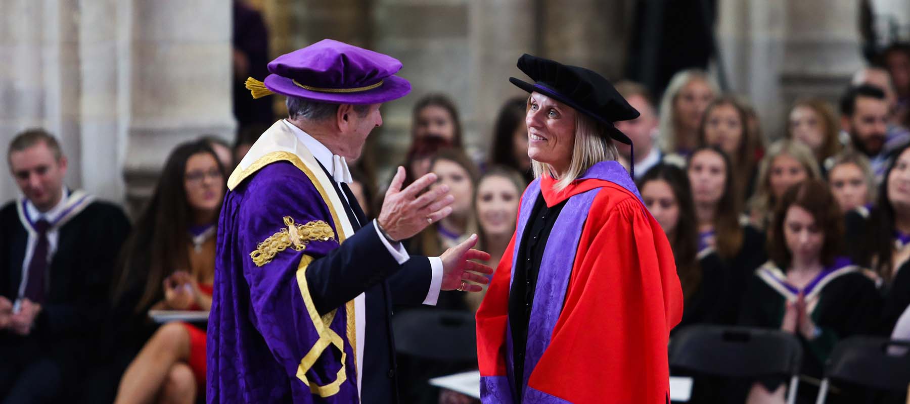 Chancellor Emeritus Alan Titchmarsh congratulates a student at Graduation