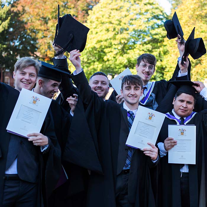 Chancellor Emeritus Alan Titchmarsh congratulates a student at Graduation