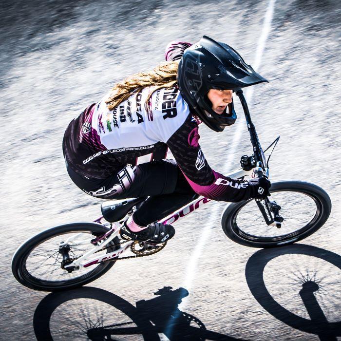 Girl BMX rider on track