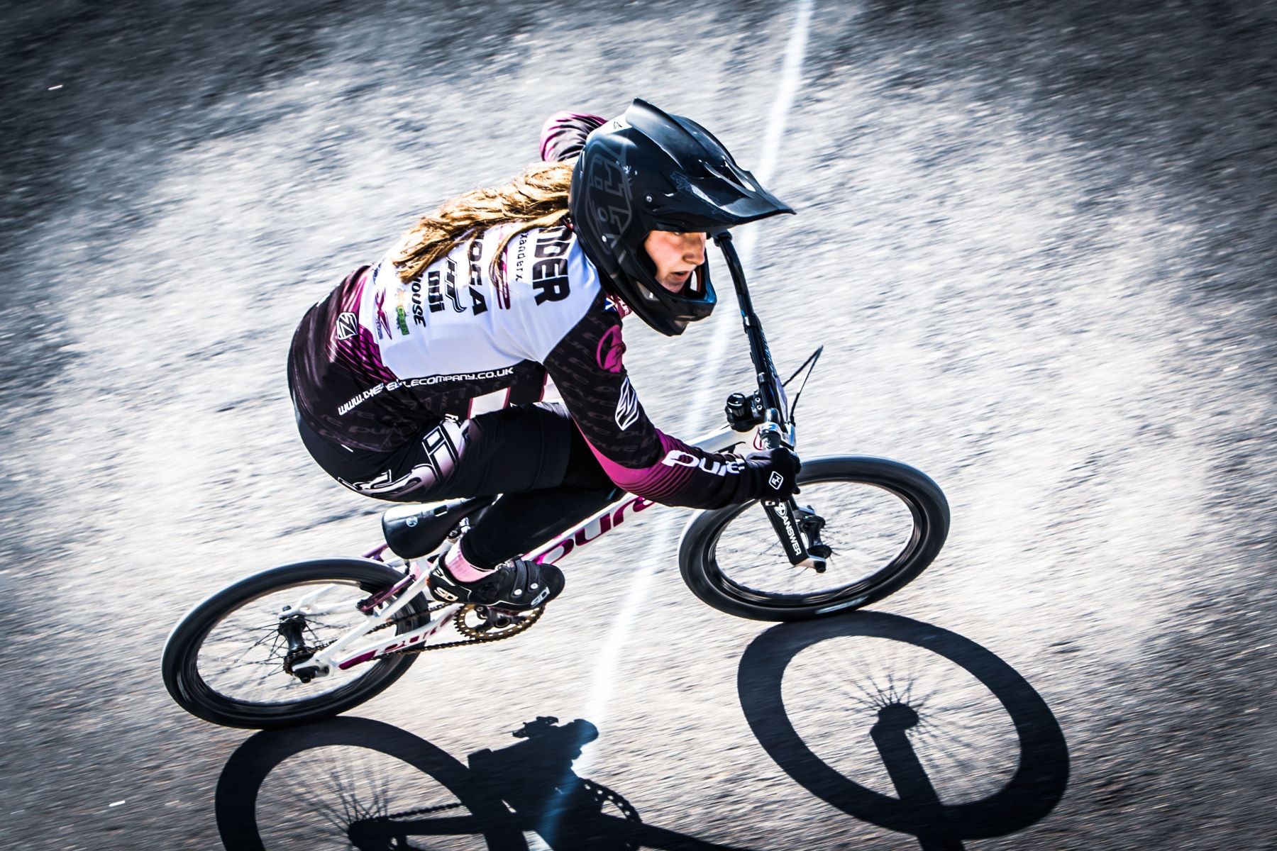 Girl BMX rider on track