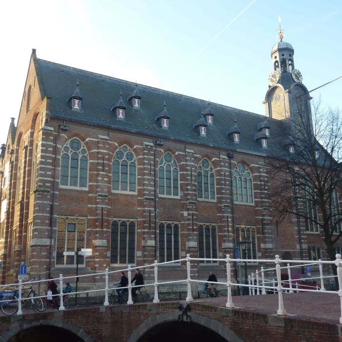 Old brick building next to a canal bridge