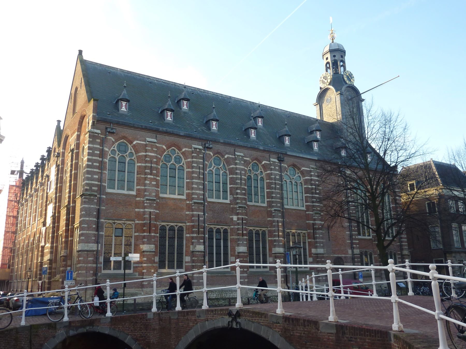 Old brick building next to a canal bridge