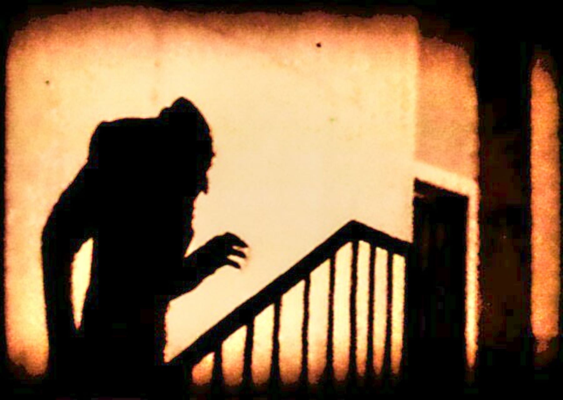 shadowy figure walking up stairs menacingly