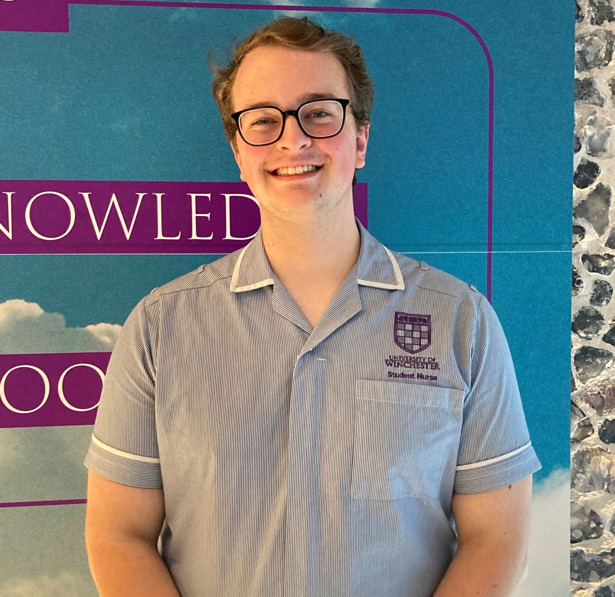 Young male student nurse with glasses