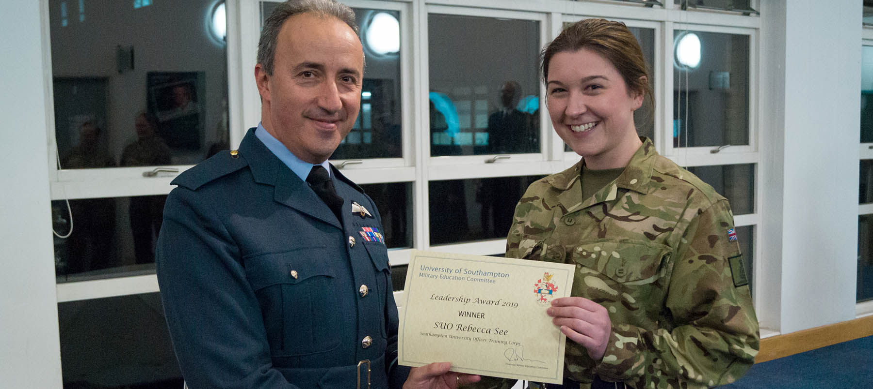 Presentation of award to Rebecca in uniform