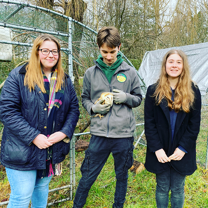 Student volunteers and owl at the Ark Centre