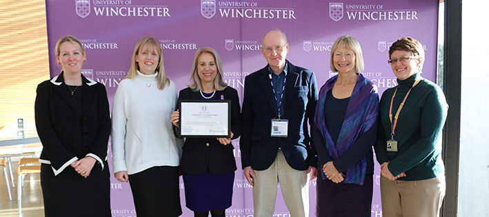 Joy Carter and Nicola Walters standing with University of Sanctuary certificate