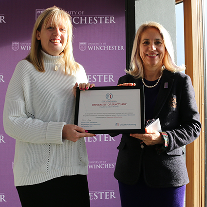 Joy Carter and Nicola Walters standing with University of Sanctuary certificate