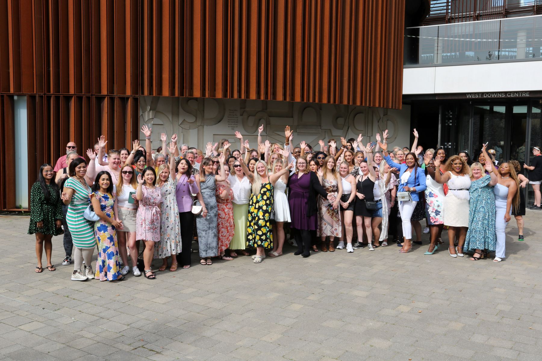 group celebrating outside west down centre