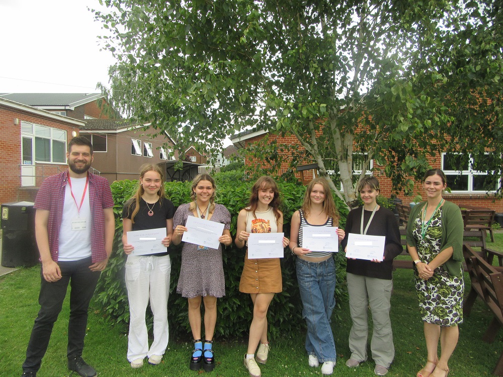 sixth form students with certificates