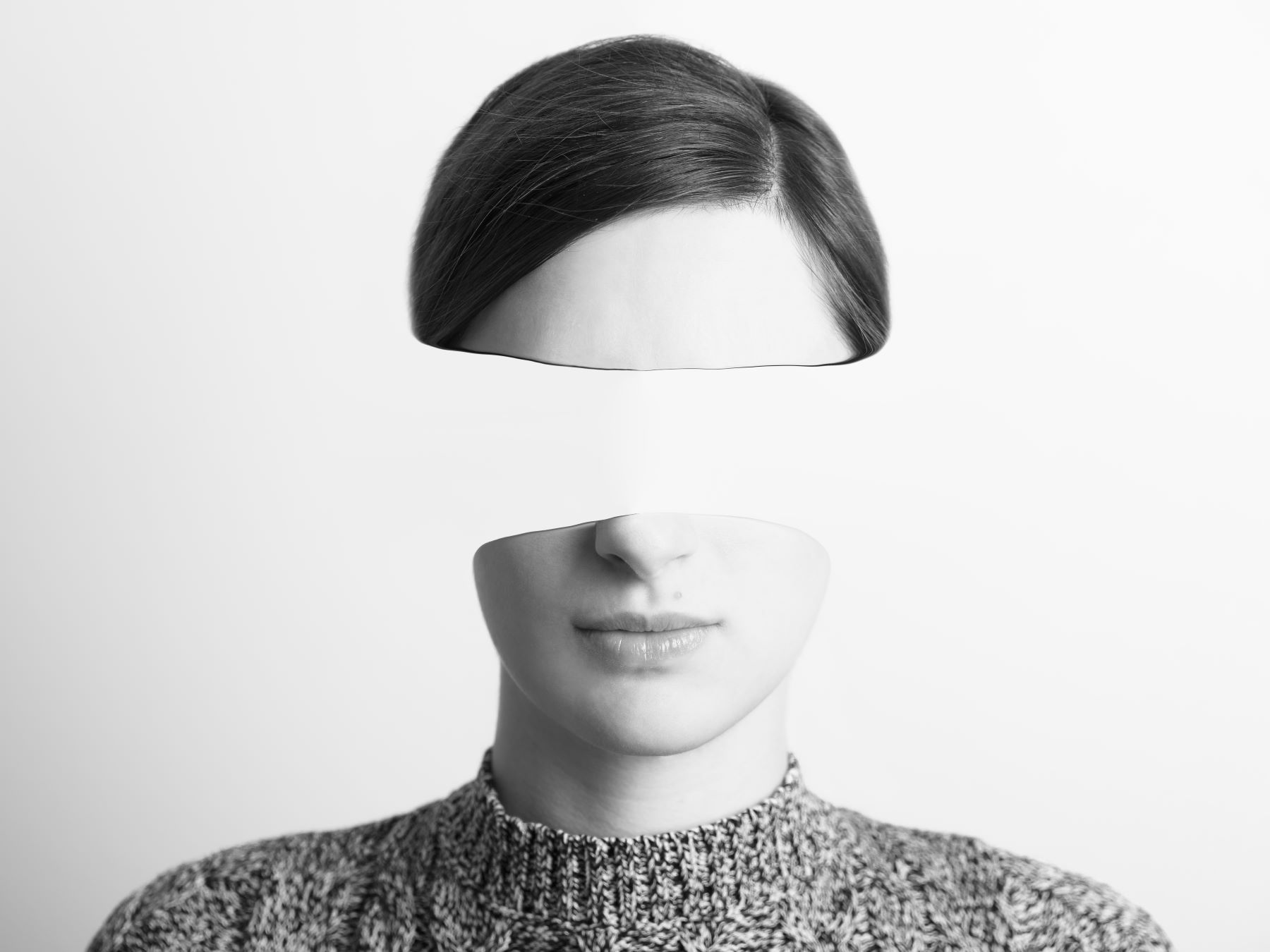 Woman's face with a big space where the eyes should be