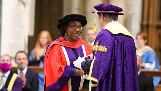 Carole Burgher receives her honorary degree from Alan Titchmarsh