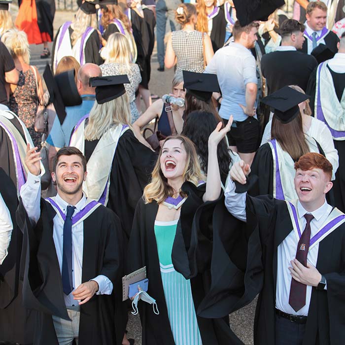 Craig revel horwood dancing on the podium at graduation