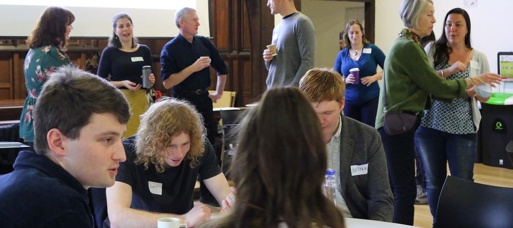 Participants in the climate assembly talking in groups