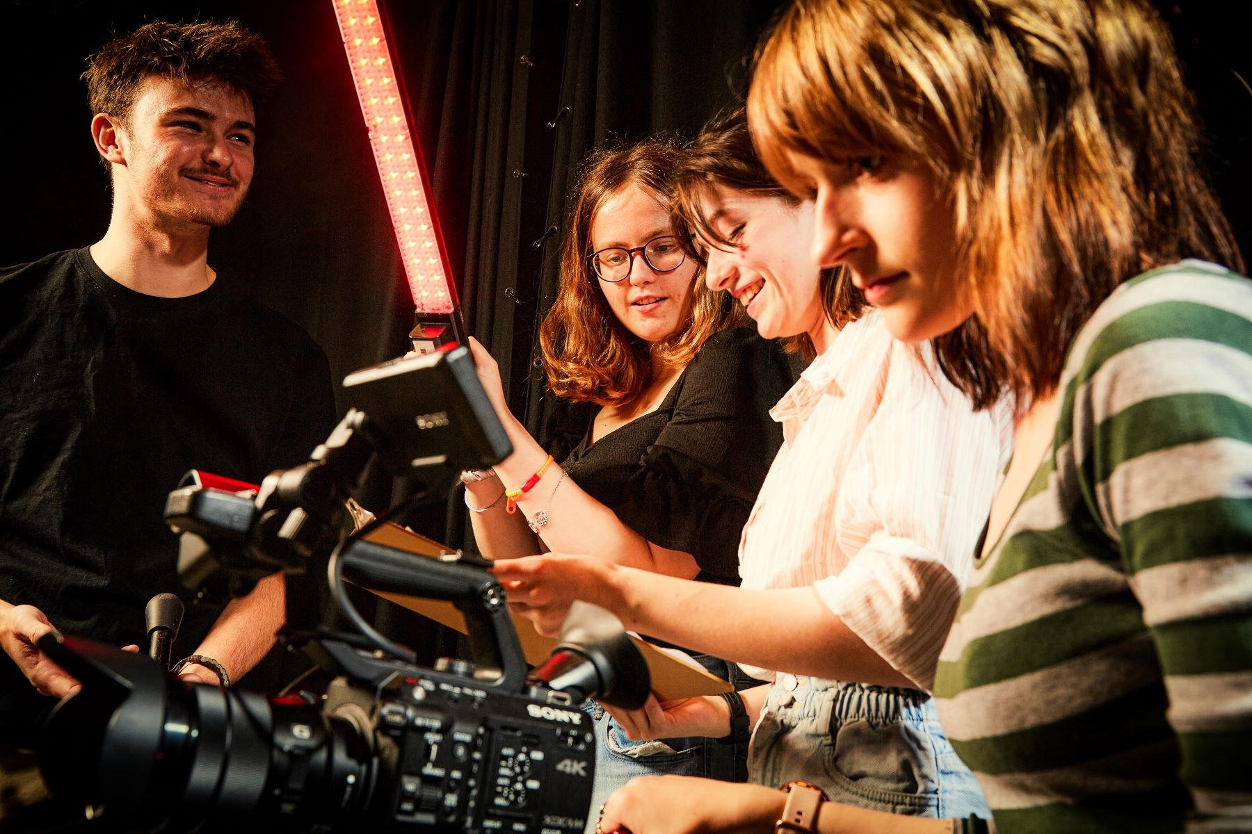 film students smiling with cameras