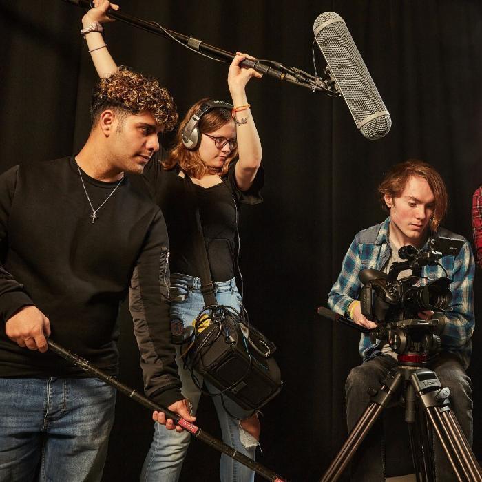 film students smiling with cameras