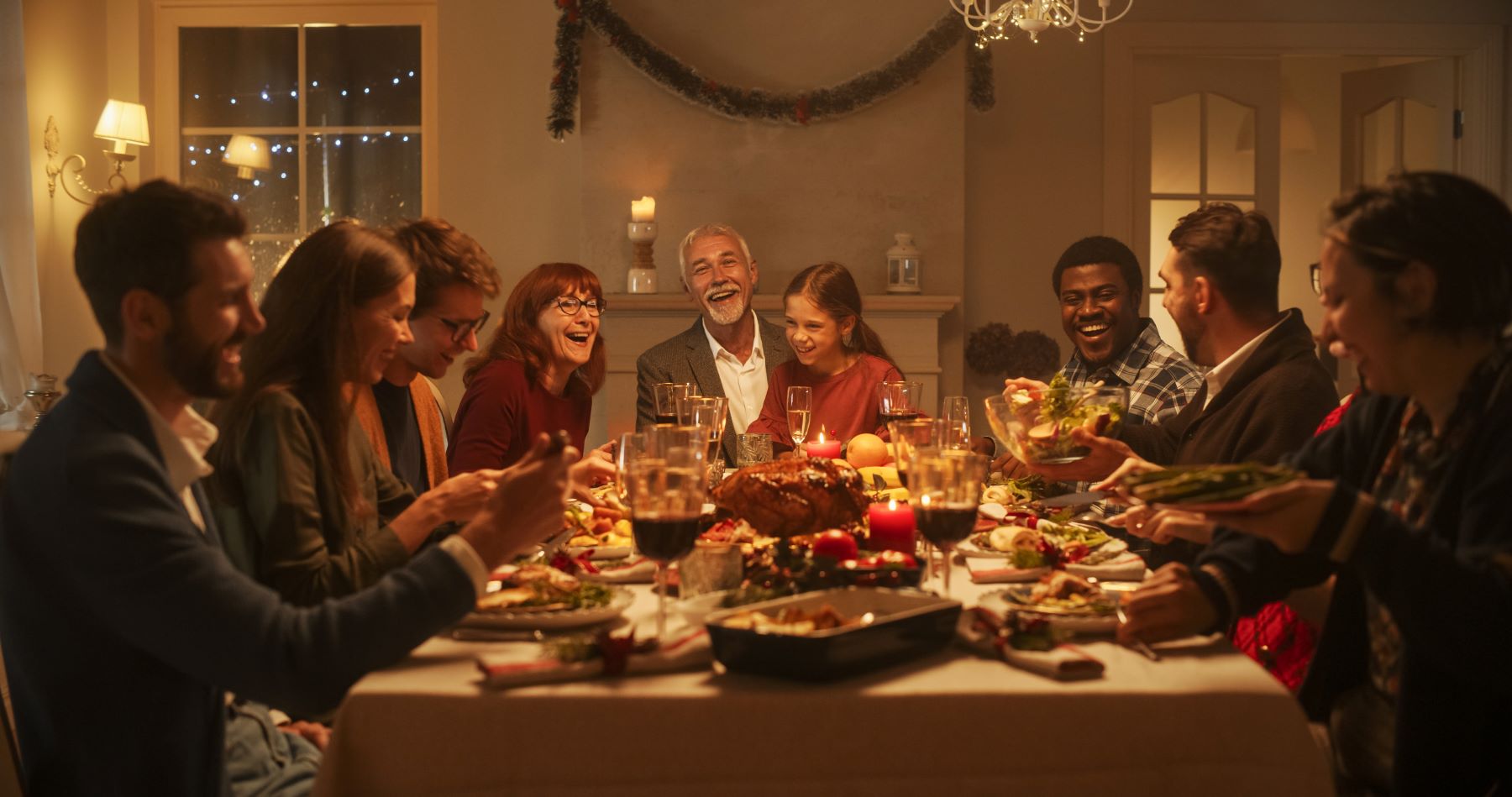 Happy family around table for Christmas dinner