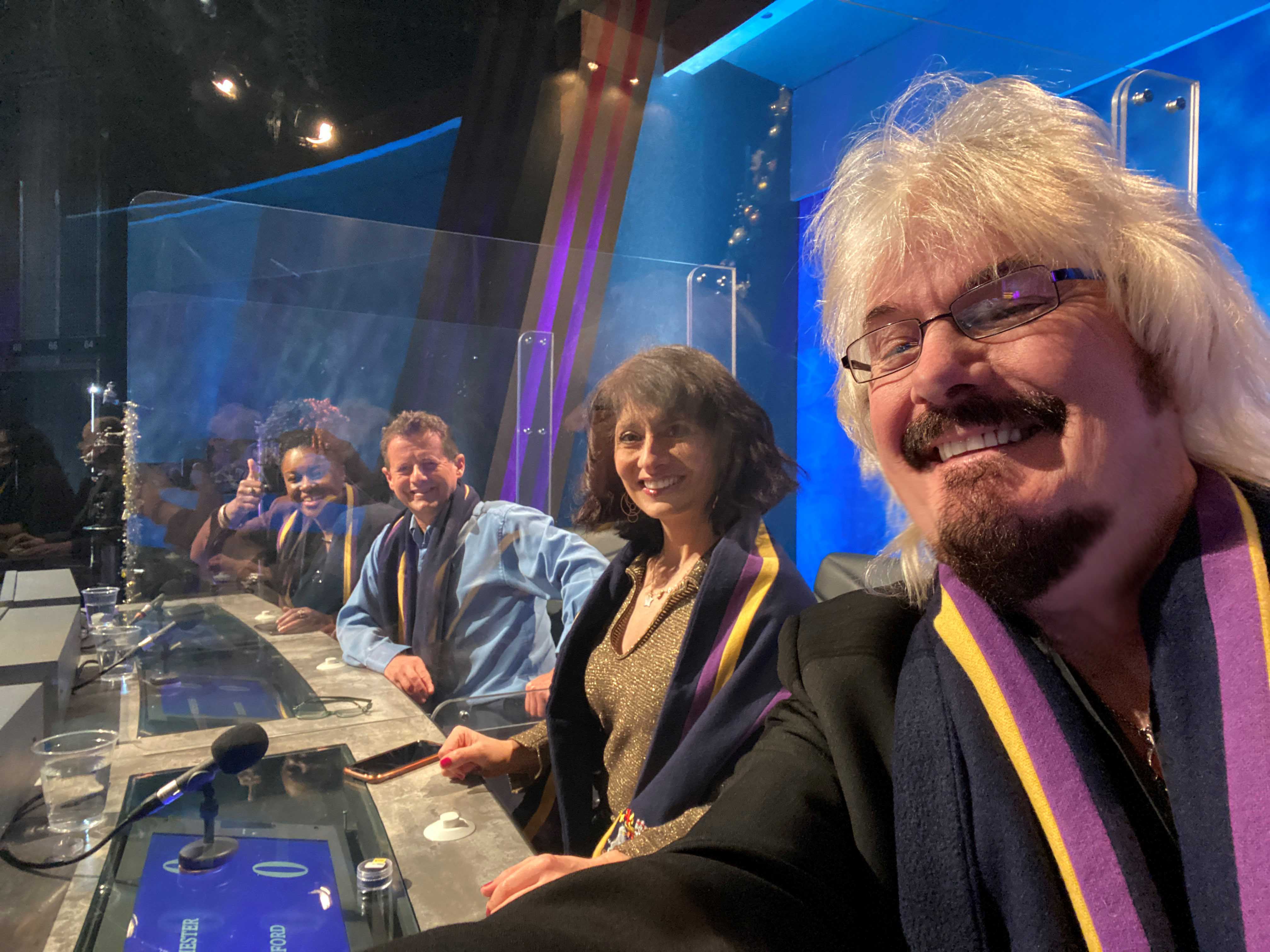 The team take a selfie on set